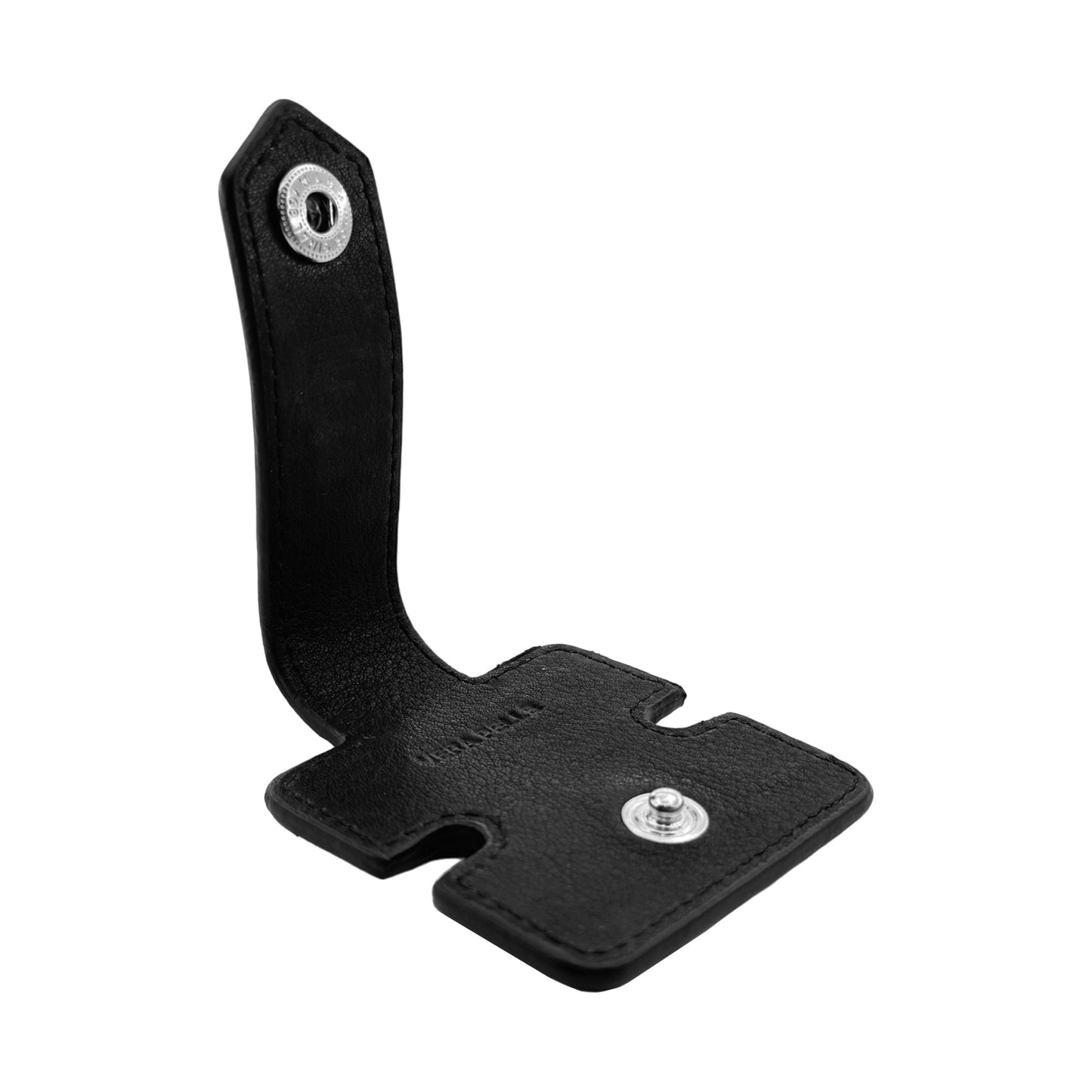K0019AB | Cable reel in full-grain genuine leather with a light grain. Black. Snap button closure. Closed dimensions: 6x6x1 cm. Packaging: Rigid gift box with bottom/lid